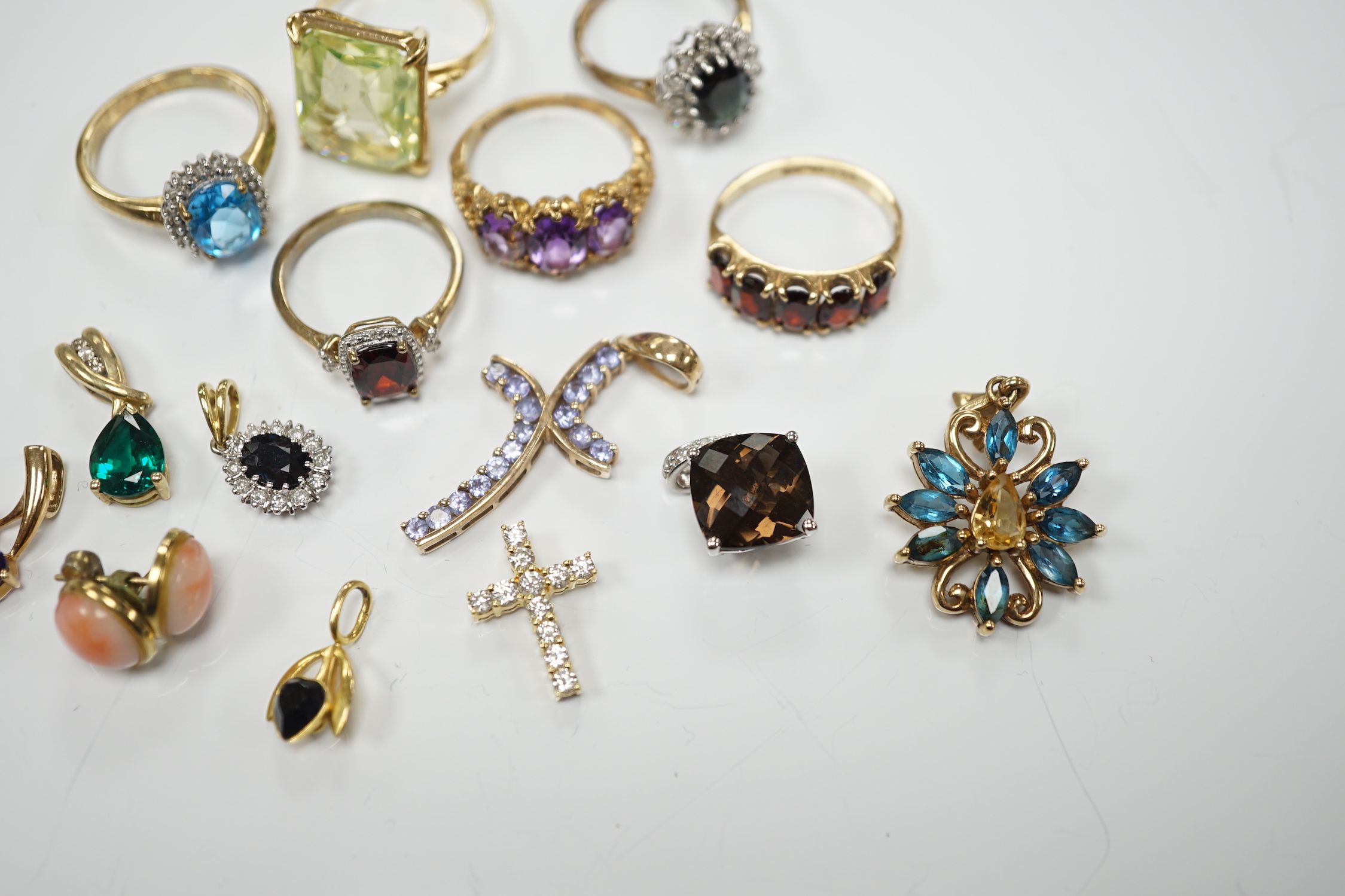 Five assorted modern 9ct gold and gem set rings, including garnet and amethyst, one other yellow metal and gem set ring, six assorted modern 9ct gold and gem set pendants, two other pendants including diamond set cross a